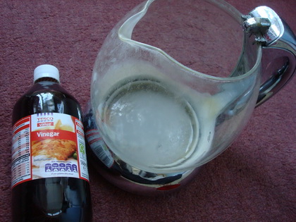 limescale covered kettle bottle vinegar